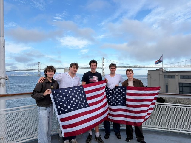 ProvenMetal team with US flags by the Bay Bridge